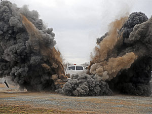 Armoured blast and ballistic protected vehicle - undergoing blast testing